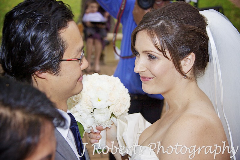 Bride and groom sharing a moment after the ceremony - wedding photography sydney